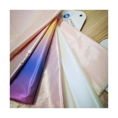 China Water Resistant Foil Finishing Cheap Pink Taffeta Fabric For Street Style Down Jackets for sale