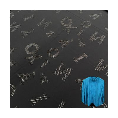 China Durable 92% Polyester 8% Spandex 100d Hole Punched Logo Pattern 4 Way Stretch Fabric For Garment Sportswear for sale