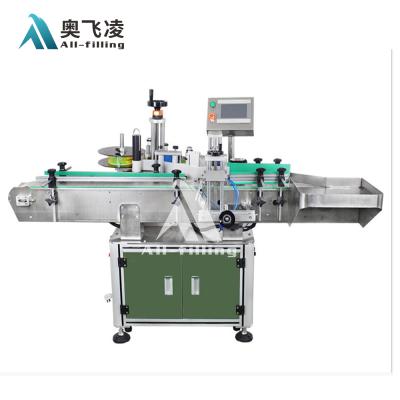 China Automatic square beverage round bottle labeling machine/self adhesive stick labeler for sale