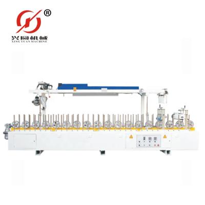 China Other Guangzhou Xingyuan WPC/PVC Profile Wrapping Machine With Cold Glue for sale