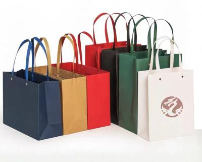 China Recyclable high quality luxury eco-friendly custom logo printed jewelry gift bag paper shopping bag folding craft paper bag with handle for sale