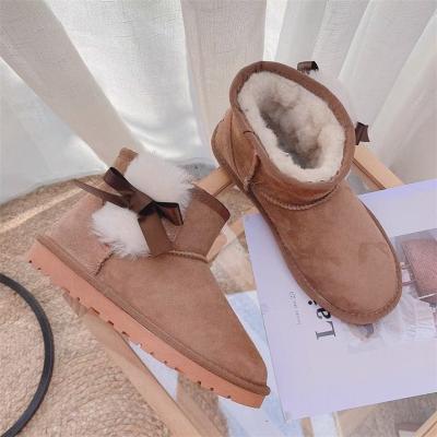 China Non-slip Breathable Lady Sheep Fur One Body Short Tube Snow Uggging Cotton Flat Thick Warm Shoes Bow Short Boots Leather for sale