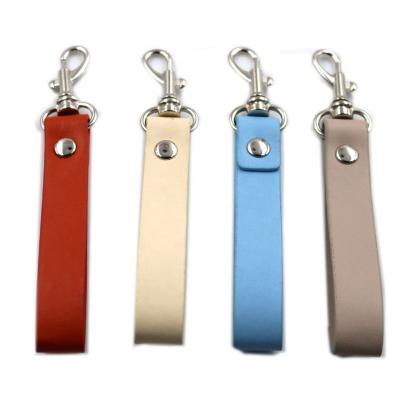 China Custom PU Leather Strap Keychain Blank Simple Design Color Souvenir LOGO Key Chain With Your Own Logo for sale