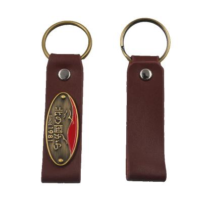 China Custom Engraved Leather Key Chain Keychain High Quality Real Metal Brand Badge Logo PU Leather Keychain for sale