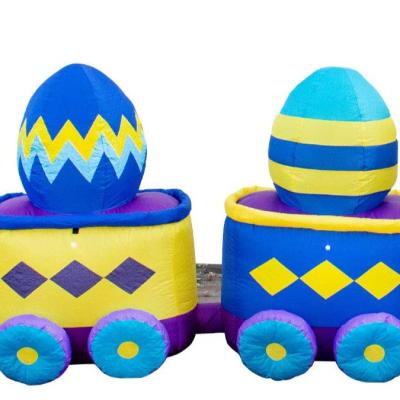 China Happy Egg Home Outdoor Airblown Easter Bunny Train Holding Eggs Inflatable Easter Yard Decor for sale