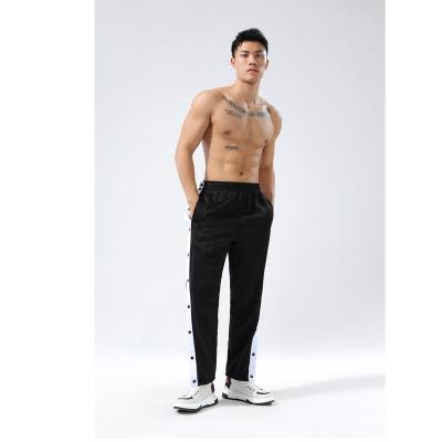 China Anti-Wrinkle Style Men Polyester Track Jogger Sports Button Elastic Loose Pants for sale