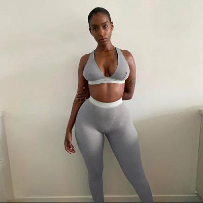 China Huan Yi Women Fashion Sport QUICK DRY Tops And Pants Clothing Female Tracksuit Teams Casual Ribbed Bra Two Piece Set for sale