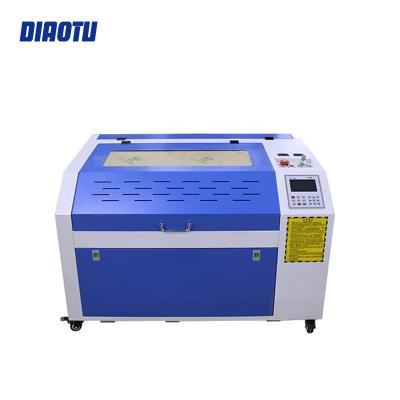 China Water Cooled Engraver Factory 4060 CO2 Laser Engraver Ruida Control Laser System Cutting Machine Laser Machine For Silicone Wristbands for sale