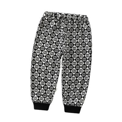 China Free Sample Breathable Letter Graffiti Printed Kids Casual Loose Sweatpants Leg Harlan Jens Pants Kid Trousers Kids for sale