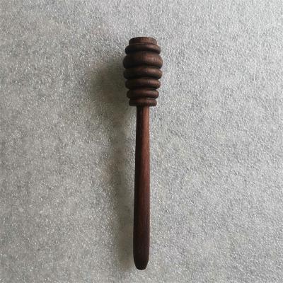 China Natural Dark Color Wooden Honey Dippers 14cm Long Black Walnut Wooden Honey Stirring Stick for sale