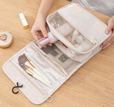 China Fashion Custom Small Make Up Bag Portable Simple Large Capacity Foldable Cosmetic Bag Hook Wash Cosmetic Bag for sale