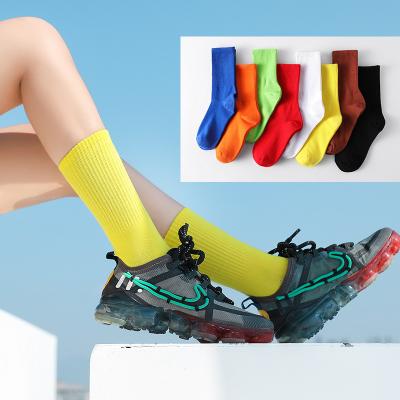 China Four Seasons Cotton Breathable Custom Socks Long Tube Tube High Stack Socks Autumn Winter Candy Color Sports Combed Socks Men for sale