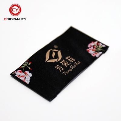 China Etiquetas Tejidas Sustainable Garment Labels Hot Sales High Density Woven Fabric Paper Size Label Tag for sale