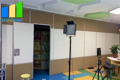 China Commercial Sound Absorbing Folding Partition Door With Pass Door for sale