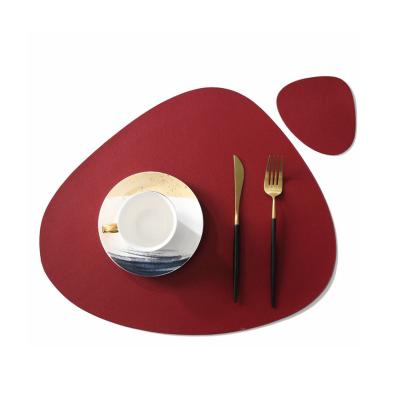 China Sustainable Modern Simplicity Irregular Shape 44cm*37cm Size Non-Slip PVC Leather Material Place Mat for sale