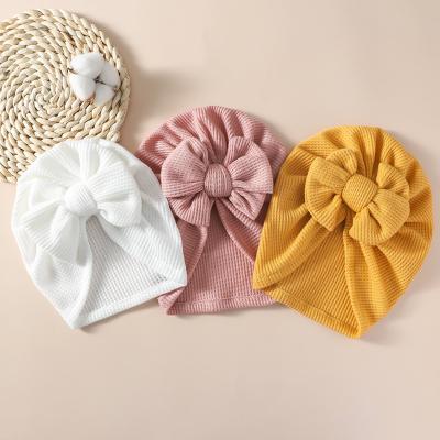 China New Boho Striped Baby Tied Bow Turban Beanie Head Wraps Newborn Baby 19 Solid Colors Knit Waffle Turban Waffle Hat for sale