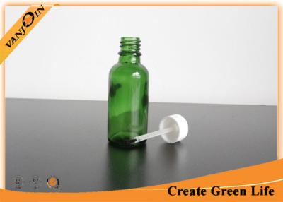 China Empty 30ml Green Essential Oil Glass Bottles Wholesale With Cap and Brush for sale