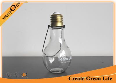 China New Design Hanging Light Bulb Glass Beverage Bottles With Metal Handle for sale