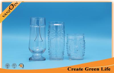 China 600ml Tiki Relief Clear Glass Beverage Bottles With Glass Stand for sale