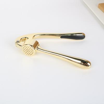 China Sustainable New Manual Garlic Press Crusher Kitchen Gadgets Zinc Alloy Masher Garlic Squeezer for sale