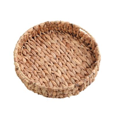 China Sustainable Rattan Water Hyacinth Hand-Woven Round Storage Holder Basket With One Handle for sale