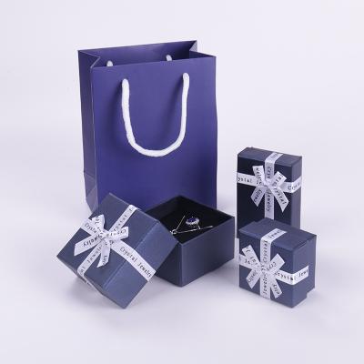 China Exquisite Eco-friendly Ribbon Necklace Jewelry Box Stud Earrings Ring Packaging Bow Ribbon Jewelry Box for sale