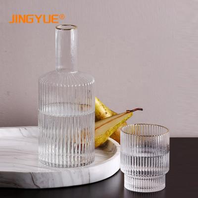 China Nordic Heat Resistant 820ml Borosilicate Cold Stored Drink Ribbed Gold Lined Glass Decanter Water Decanter For Wine Juice Whiskey for sale