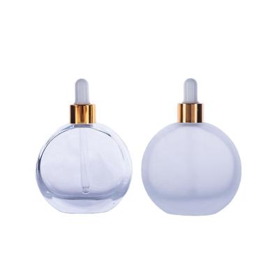 China 50ml Round Shape Perfume Glass Cosmetic Clear Bottle For Hair Oil Used With Glass Dropper for sale