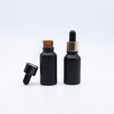 China Matte Essential Oil Cosmetic 15ml Painted Black Glass Bottle Wholesale for sale