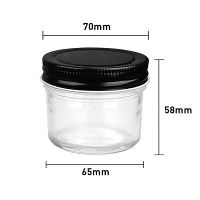 China 100ml Clear Round Glass Food Jars For Food Packaging With Screw Off Cap for sale