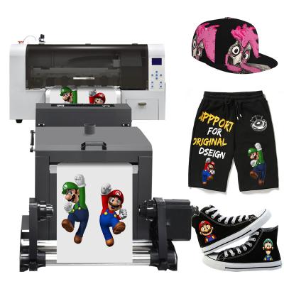 China Print Stores latest technology DTF printer for uniform pillows / bags dual main dtf xp-600/i3200 printer for sale