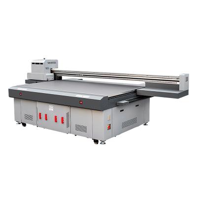 China Retail CMYKW Varnish UV Sticker Printer DTF Automatic UV Flatbed Printer for sale