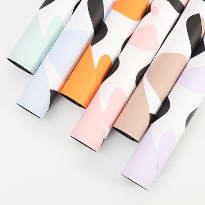 China Waterproof Manufacturer Unique Pattern Flower Gift Wrapping Paper Colorful Waterproof Paper For Bouquet for sale