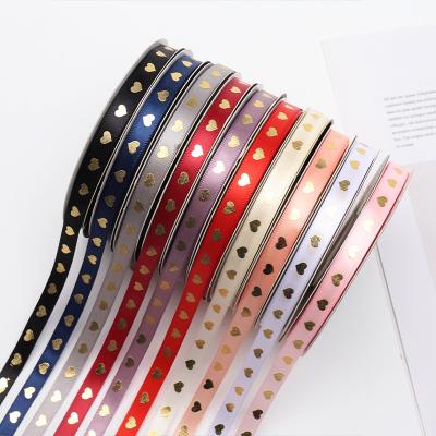 China LOW MOQ floral cheap printed heart colored gold foil printed grosgrain ribbon for gift bouquet for sale