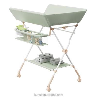 China Universal Collapsible Baby Diaper Table Foldable/Breathable/Washable Care Changing Table with Bath for Babies for sale