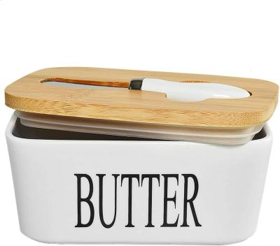 China Sustainable Kitchen Food Storage Container Airtight Ceramic Butter Dish With Lid And Knife for sale