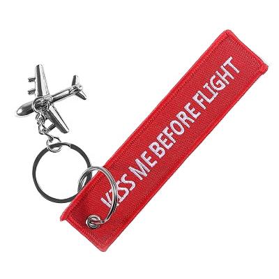 China Promotion Gift KISS ME BEFORE FLIGHT Embroidery Keychains With Metal Airplane Keyring Remove Before Flight Key Chains Duplex Souvenir Red for sale