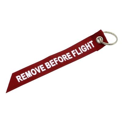 China Polyester Ribbon Fashion Key Chain Remove Before The Flight Ribbon Key Chain Custom Ribbon Key Indicator for sale