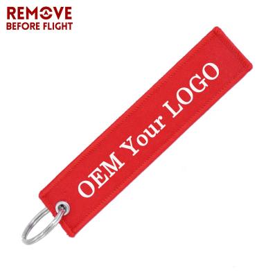 China Customize Ring Fashion Jewelry OEM Key Chain Luggage Tag Embroidery Custom Key Chains REMOVE BEFORE FLIGHT Tag for sale