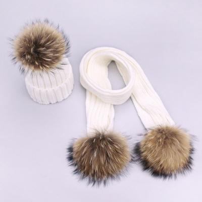 China COMMON children's two wool ball wool hat scarf set men's and women's raccoon fur pompom wool ball knitted ear set thickened wholesale for sale