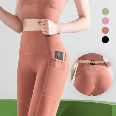 China Women Solid Color Breathable Noraml Plus High Waist Yoga Gaiters Pants With Cell Phone Pocket for sale