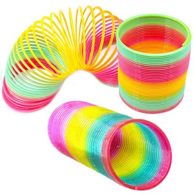 China Children's Spring Toy Pull Ring Magic Rainbow Ring Oversized Nostalgic Colorful Elastic Ring Educational Toys SNAPSHOT for sale