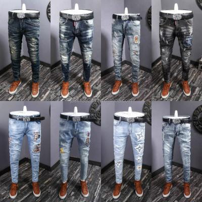 China QUICK DRY Mens Slim Jeans With Holes Shape Mens Jeans Ripped Washed Denim Fabric Blue Heavily for sale