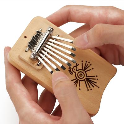 China Good Gift Musical Exquisite Mechanical Marimba Piano Thumb Finger Mini Kalimba Pendant Accessory 8 Key 8 Notes for sale