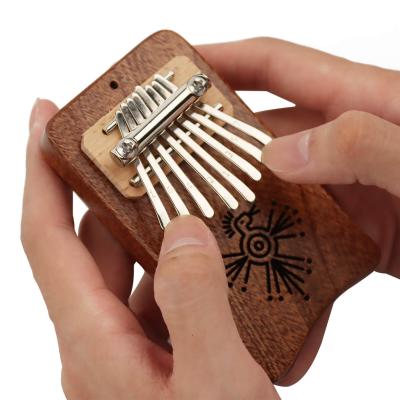 China Good Gift Kalimba 8 Thumb Finger Piano Mechanical Head Exquisite Musical Marimba Accessory Pendant for sale