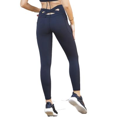 China Trimming Resistance Women Yoga Pants Stacked Jogging Slimming Panties Bamboo Spandexs Lift Hollow Out High Waisted Ripped Fitness Leggings for sale