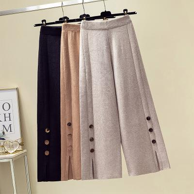 China Solid Color QUICK DRY Spring Hot Buttons Split Elastic Waist Knit Pants Women Wide Leg Knitted Pants for sale