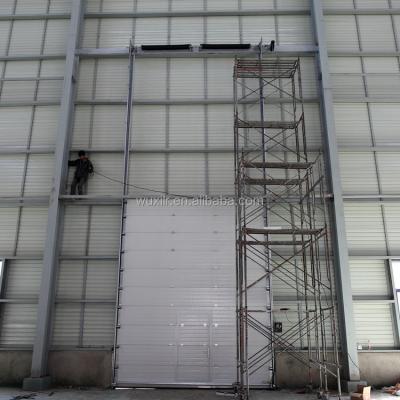 China Automatic Steel Industrial Overhead Vertical Sliding Door for sale