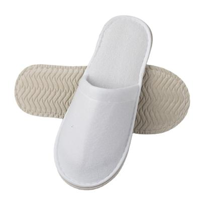 China Exquisite Disposable Hotel Amenities Wholesale White Terry Slipper Indoor Disposable Traveling Hotel Slippers Custom Made for sale