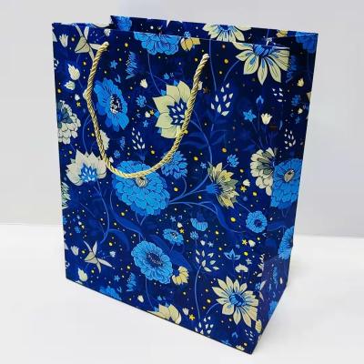 China Custom Blue Recycled Materials Paper Gift Packaging Bag Clothing Shopping Mall Shoes Gift Cosmetics Recycled Shopping Handbag for sale